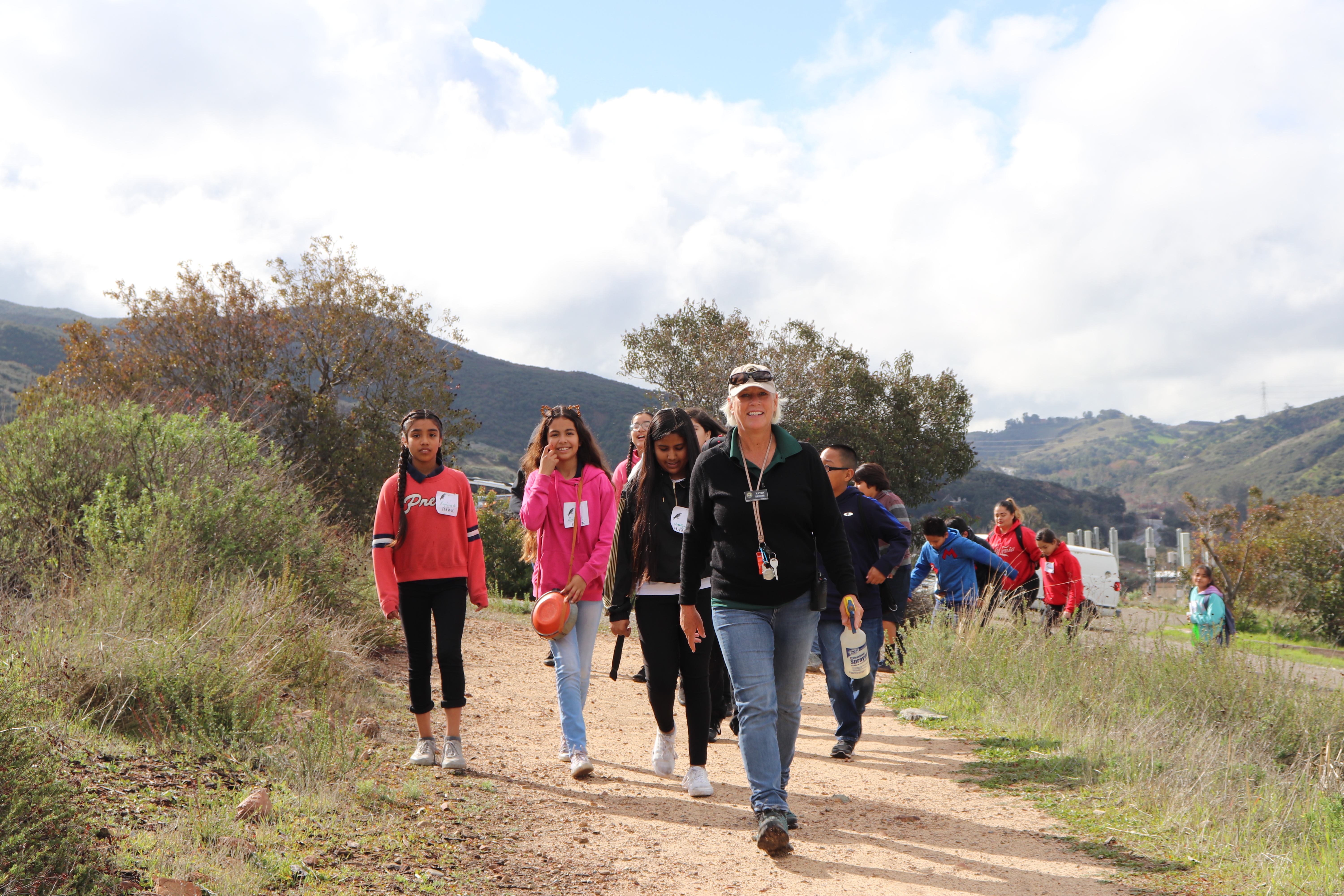 Naturalist walking with students in Chaparral