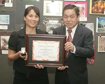  Sarah Rafael Garcia, Author and Founding Director of "Barrio Writers" program, with Board Member Dr. Long Pham 